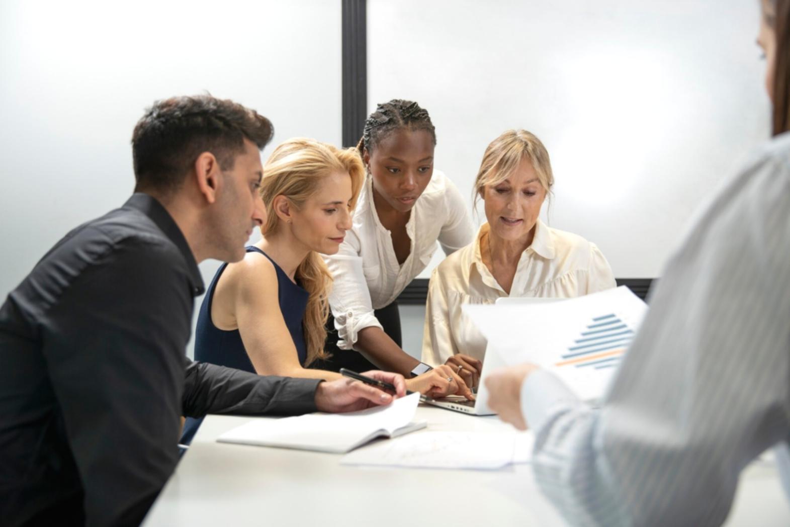 Professional reviewing financial statements and market data